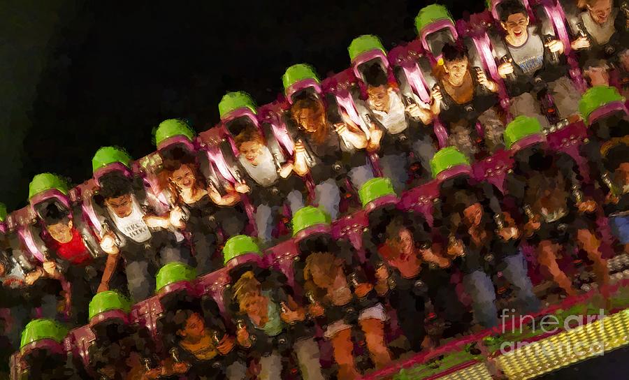 Young riders on an amusement ride at the Montgomery County Fair in Gaithersburg Maryland USA Photograph by William Kuta
