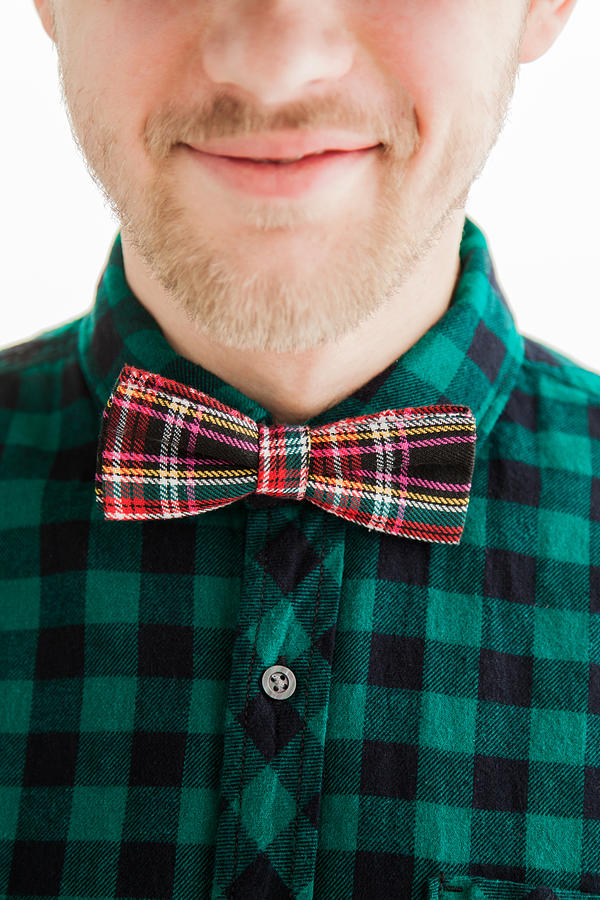 Young smiling man in bowtie Photograph by Boytsov