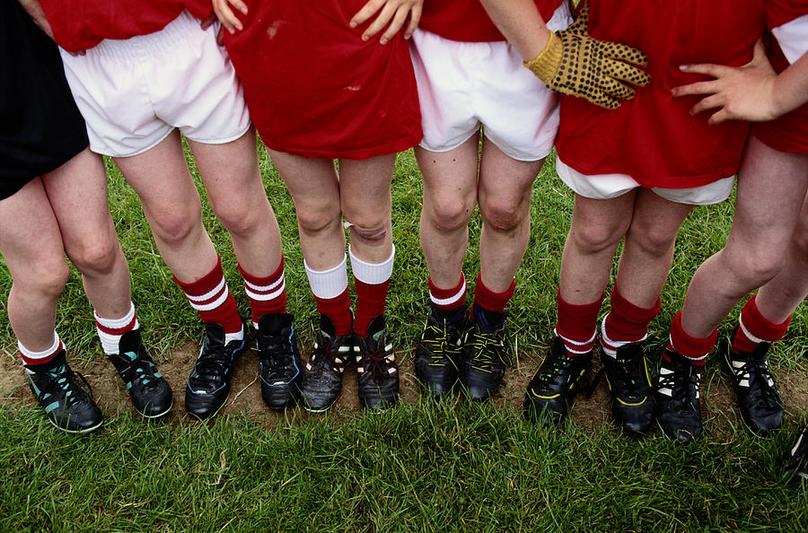 Young Soccer Players Legs Photograph by Grant Faint