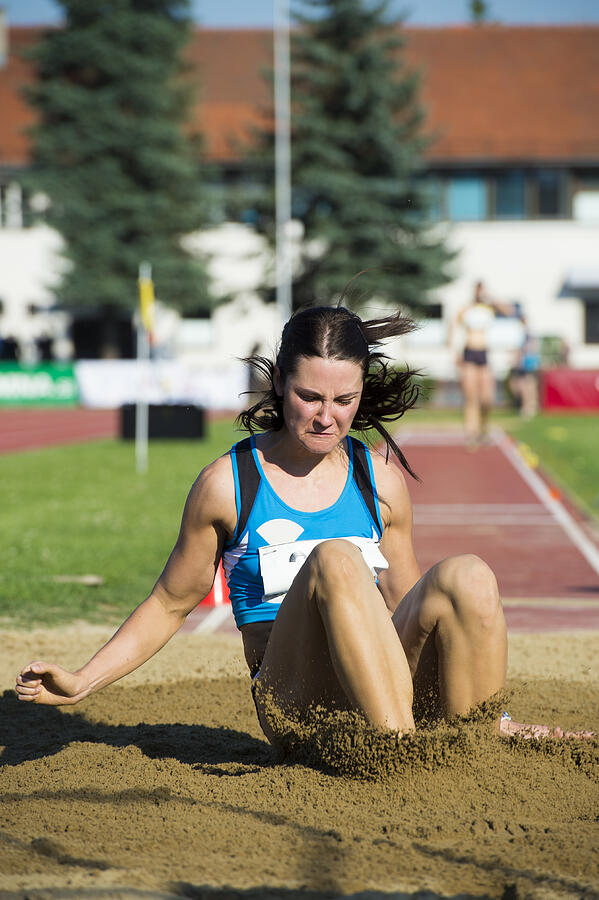 Young woman at long jump Photograph by Technotr