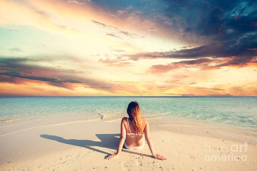 Young woman beach relax in Maldives at sunset Photograph by Michal Bednarek