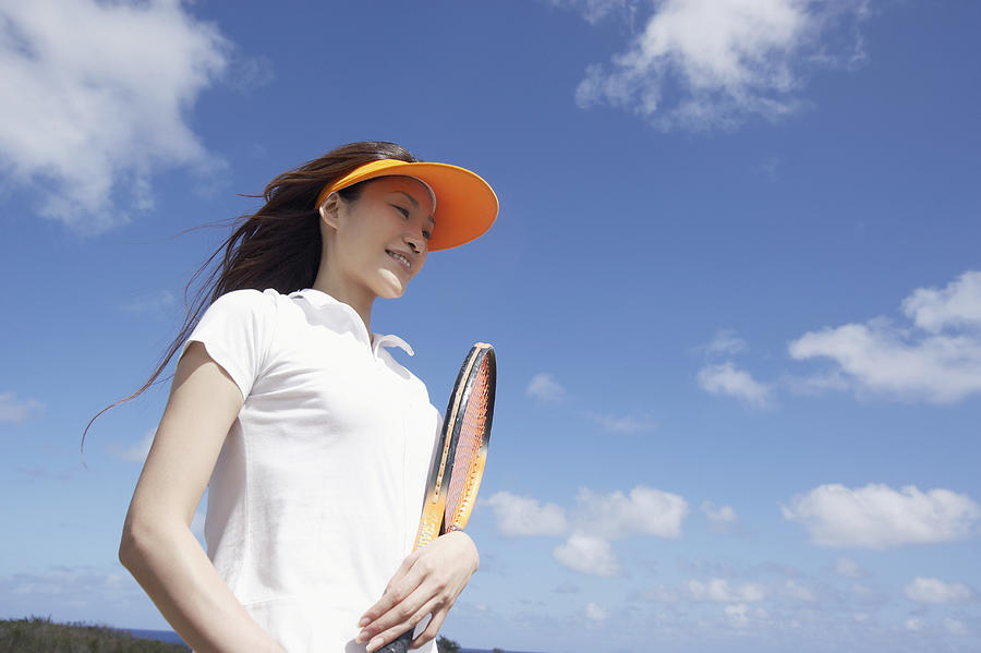 Young Woman Holding a Tennis Racquet Photograph by Dex