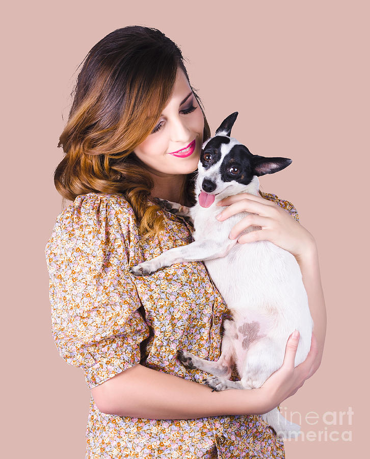 Young woman holding dog Photograph by Jorgo Photography