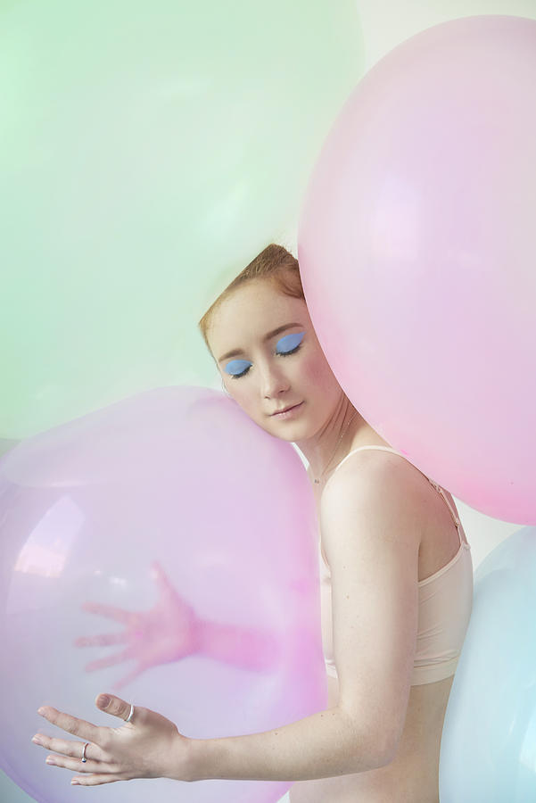 Young Woman Hugging Balloon Photograph by Tara Moore