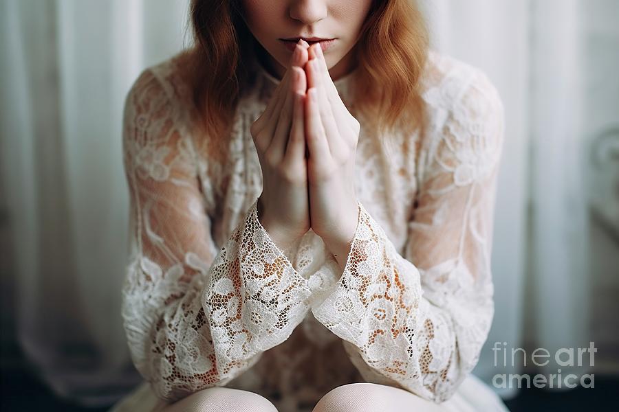 Young woman in traditional vintage clothing, in worry pose with hands as if praying. Photograph by Joaquin Corbalan