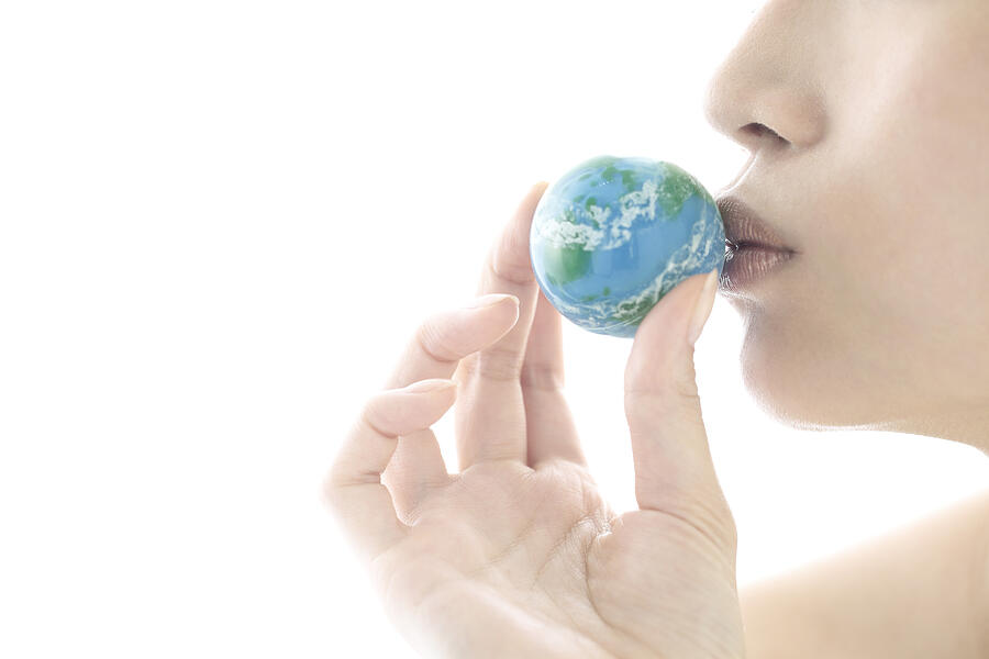 Young Woman Kissing The Globe Ball,lip Close Up Photograph by RunPhoto