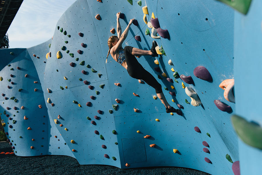 Young woman on climbing wall, Brooklyn Bridge Park, Brooklyn, New York, USA Photograph by Matt Dutile Young woman on climbing wall, Brooklyn Bridge Park, Brooklyn, New York, USA Photograph by Matt Dutile