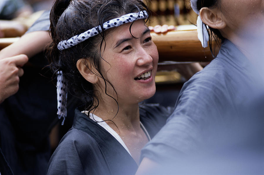Young woman participating in water sprinkling festival Photograph by Kazuko Kimizuka