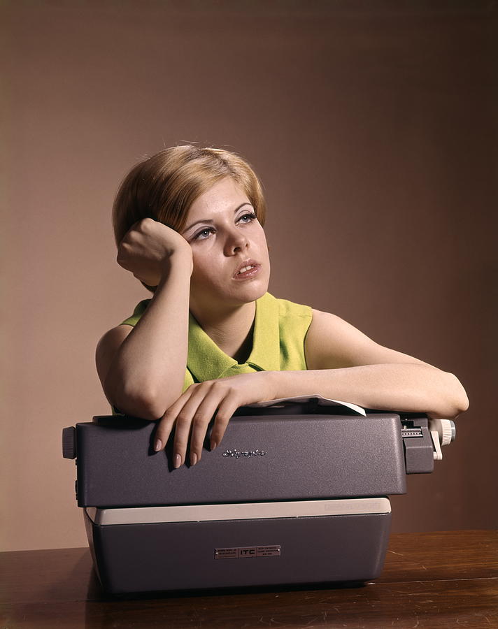Young Woman Secretary Propping Up Head And Leaning On Typewriter Bored Daydreaming. Photograph by H. Armstrong Roberts