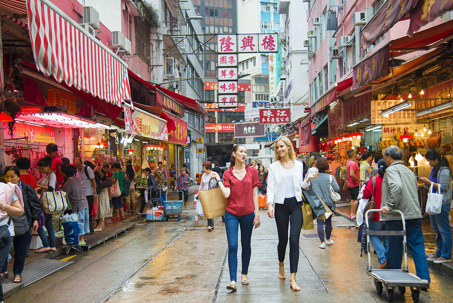 Young Woman Shopping in Hong Kong Photograph by OwenPrice