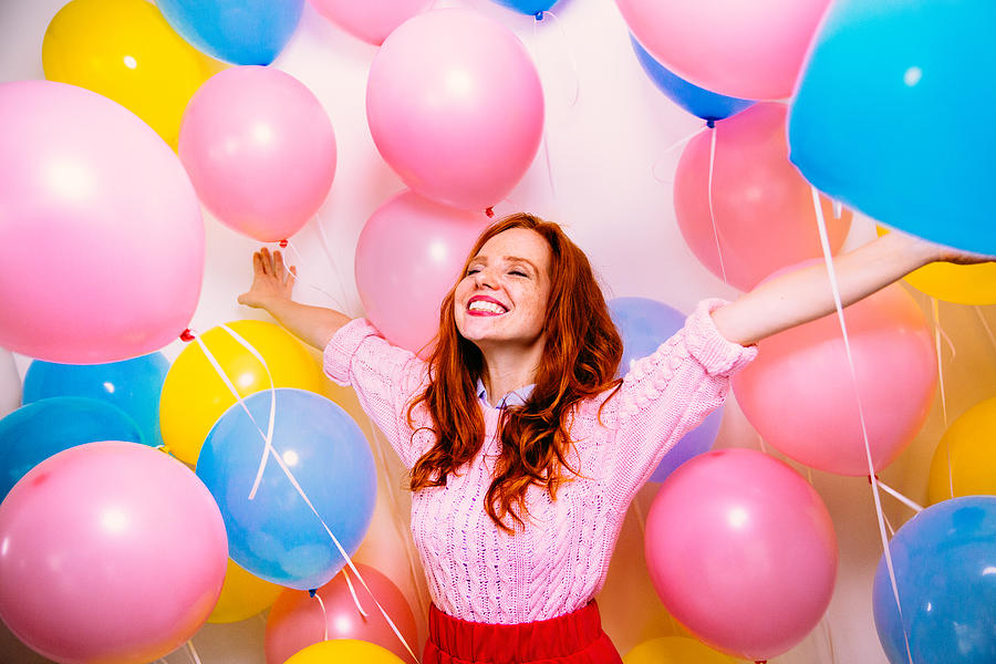 Young Woman Standing In Many Balloons Photograph by Wundervisuals