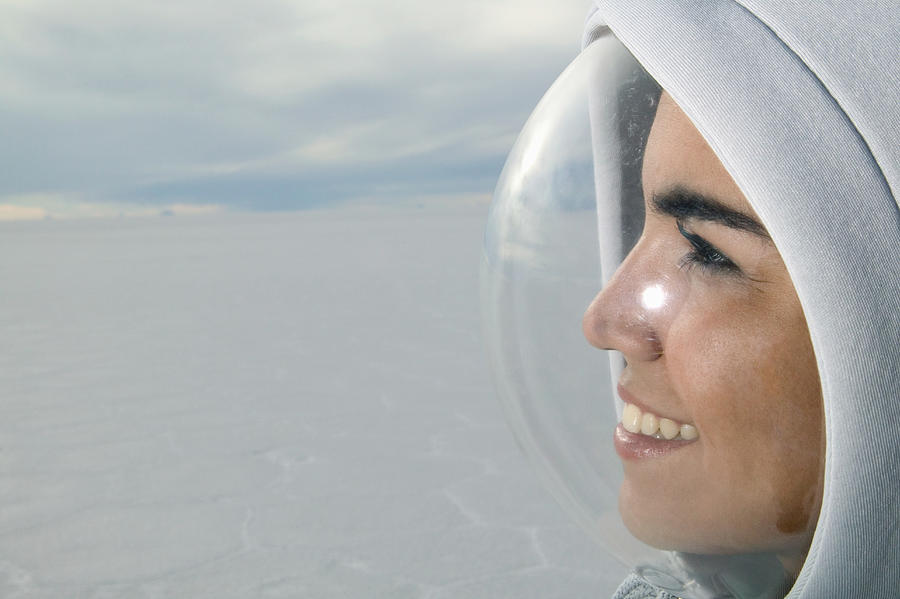 Young woman wearing protective bubble on face, side view, close-up Photograph by Matthias Clamer