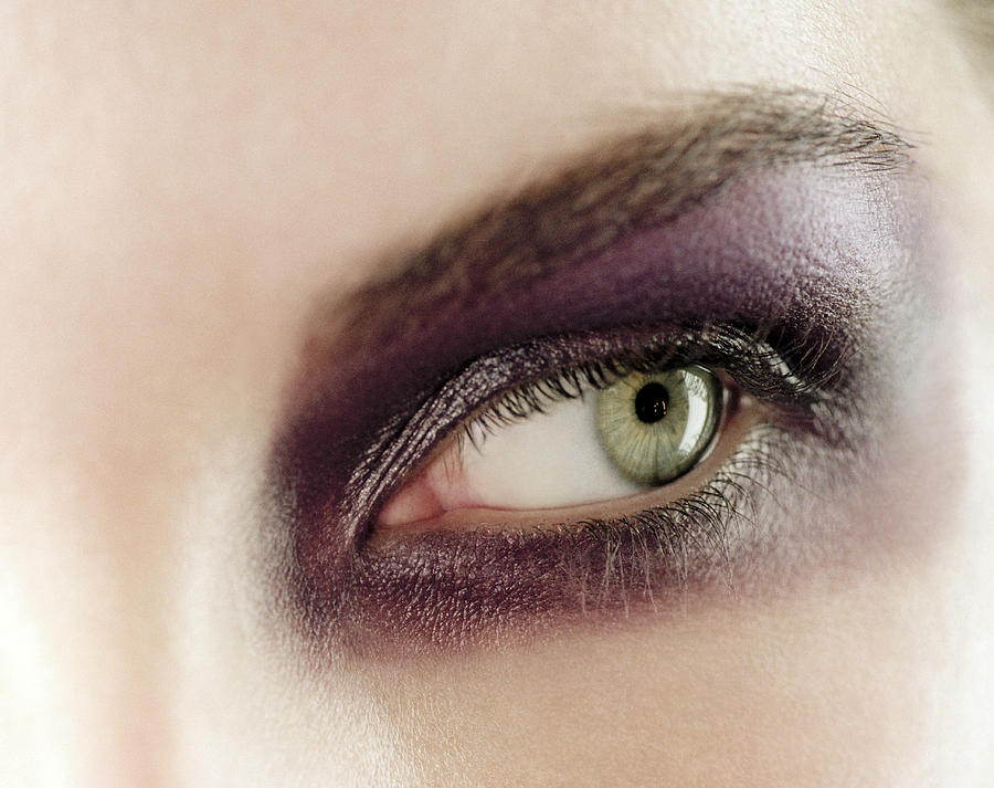 Young woman wearing purple eyeshadow, close-up of eye Photograph by Veronique Beranger