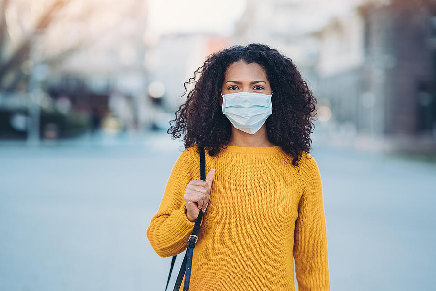 Young woman with a mask during pandemic Photograph by Pixelfit