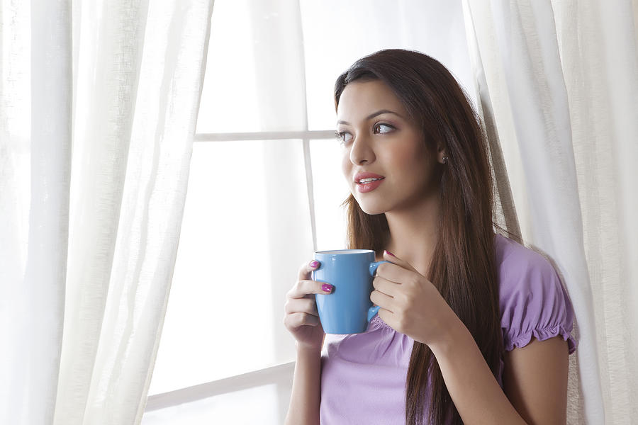 Young woman with a mug of tea Photograph by Ravi Ranjan