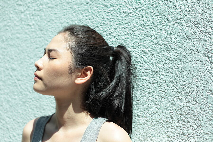 Young Woman With Eyes Closed Photograph by Runstudio