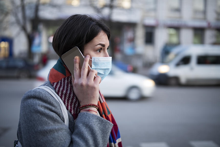 Young Woman With Face Mask Talking On The Phone. Photograph by ArtistGNDphotography