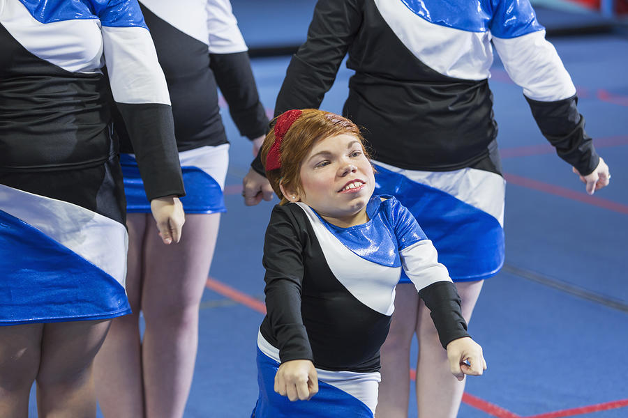 Young woman with Morquio syndrome on cheerleading team Photograph by Kali9