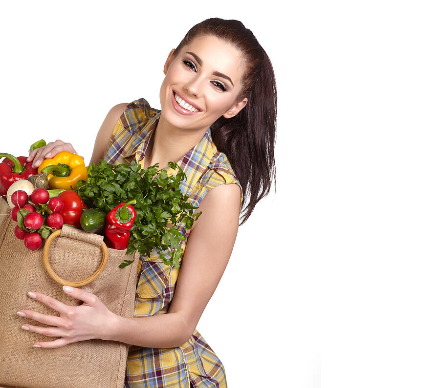 Young woman with vegetables and fruits in shopping bag Photograph by ThomFoto