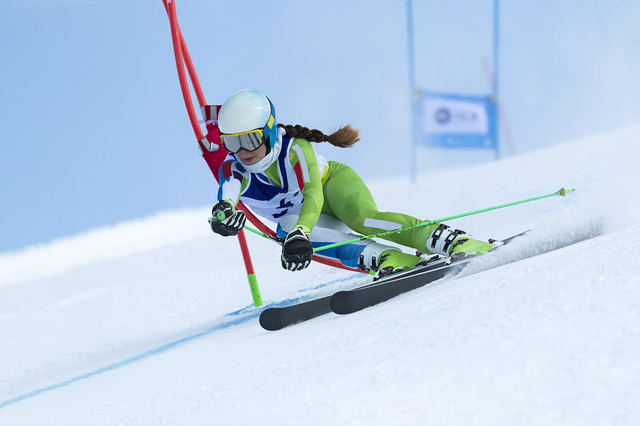 Young Women at Giant Slalom Against the Blue Sky Photograph by Technotr