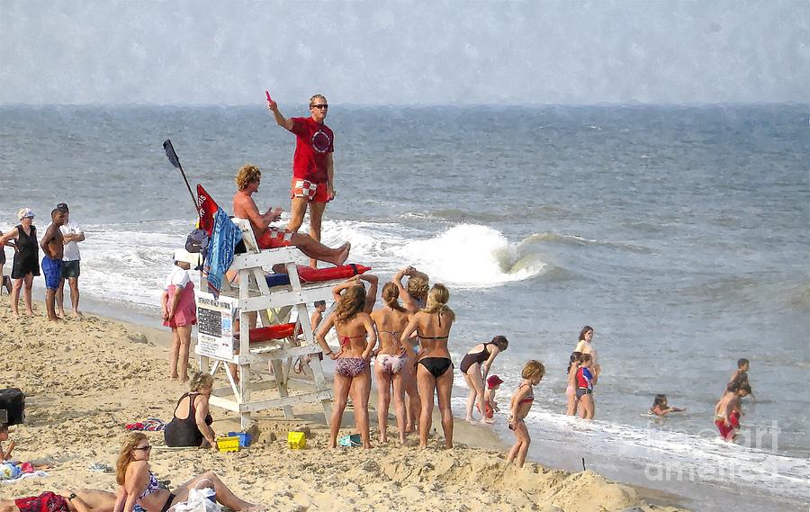 Young women chat up the lifeguards on an Atlantic beach Photograph by William Kuta