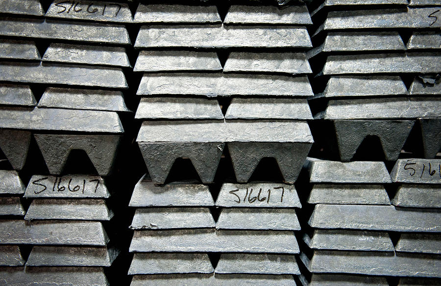 Zinc ingots, used to coat galvanized nails, sit stacked in a warehouse Photograph by Bloomberg Creative Photos