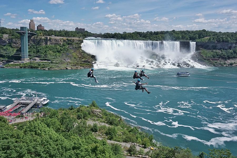 Ziplining by Niagara Falls, a new attraction for thrill seekers, a fun way to experience the natural wonder Photograph by Jana Kriz