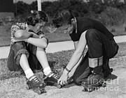 Boy Helping Girl With Roller Skates Photograph by H. Armstrong Roberts/ClassicStock