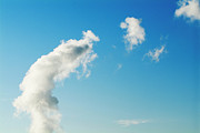 Clouds floating across a blue sky Photograph by Sami Sarkis Photography