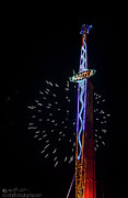 Fun fair ride and fireworks Photograph by B Cash