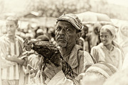Old ethiopian man selling a rooster in a market Photograph by Miroslav Liska