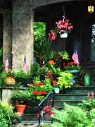 Porch With Geraniums and American Flags Photograph by Susan Savad