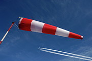Windsock and airplane against sky Photograph by Sami Sarkis Photography