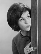 Woman Peeking Around Corner, C.1960s Photograph by H. Armstrong Roberts/ClassicStock