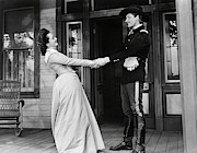 OLIVIA DE HAVILLAND and ERROL FLYNN in THEY DIED WITH THEIR BOOTS ON -1941-. #1 Photograph by Album