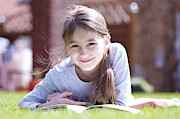 Girl Lying On Grass Reading #2 Photograph by Science Photo Library