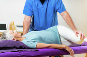 Physical Therapist Stretching Senior Woman #2 Photograph by Science Photo Library
