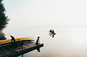 Two People In Fishing Boat In The Fog With Dog Watching From The Dock. #3 Photograph by Cavan Images