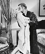 CARROLL BAKER and GEORGE PEPPARD in THE CARPETBAGGERS -1964-. Photograph by Album