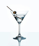Dry martini with green olive in cocktail glass over white backgr Photograph by Jelena Jovanovic