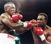 Evander Holyfield Punching Buster Photograph by Bettmann