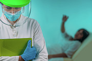 Exhausted Medical Worker In Ppe Photograph by Science Photo Library