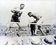 Jack Dempsey Ducking Jess Willard Punch Photograph by Bettmann