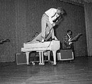 Jerry Lee Lewis Singing Atop A Piano Photograph by Bettmann