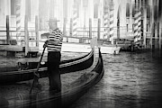 Lone Gondolier Venice Italy Black and White  Photograph by Carol Japp