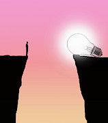 Man Looking At Glowing Light Bulb Photograph by Ikon Images