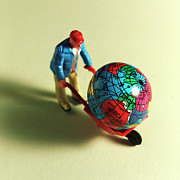 Man With Globe in Wheelbarrow Drawing by CSA Images