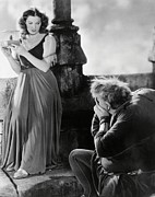 MAUREEN O'HARA and CHARLES LAUGHTON in THE HUNCHBACK OF NOTRE DAME -1939-. Photograph by Album