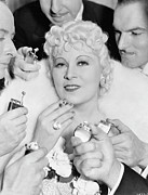 Men Offering To Light Cigarette For Mae Photograph by Bettmann