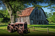 Old Vintage McCormick Deering Tractor with old weathed Barn Photograph by Randall Nyhof
